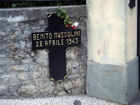 Photo of cross marking place Mussolini was killed