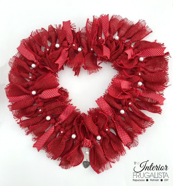 How to make a simple heart-shaped rag wreath for Valentine's Day with red burlap ribbon for a budget-friendly handmade Valentine door wreath idea.