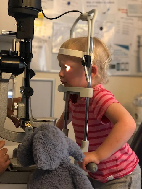 Toddler getting her scratched eye checked at Moorfield's eye hospital