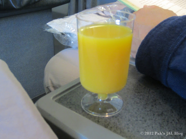 AA pre-departure range juice served in a plastic glass
