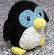 http://www.ravelry.com/patterns/library/amigurumi-howie-the-holiday-penguin