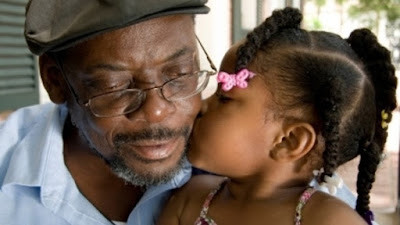 Black grandparent with granddaughter