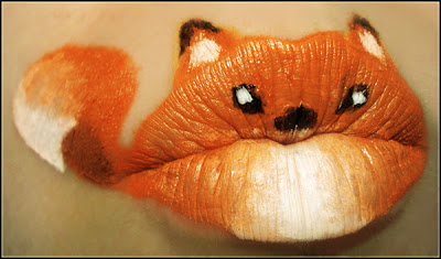 close up of lips painted to look like a little red fox