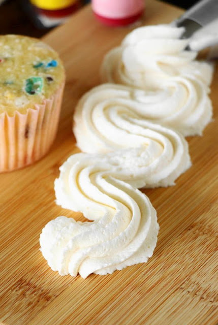 Homemade Vanilla Buttercream Frosting ~ Fluffy, creamy, sweet-but-not-too-sweet, and loaded with great vanilla flavor! This frosting will have you clamoring for that piled-high cupcake or corner piece of cake.  www.thekitchenismyplayground.com