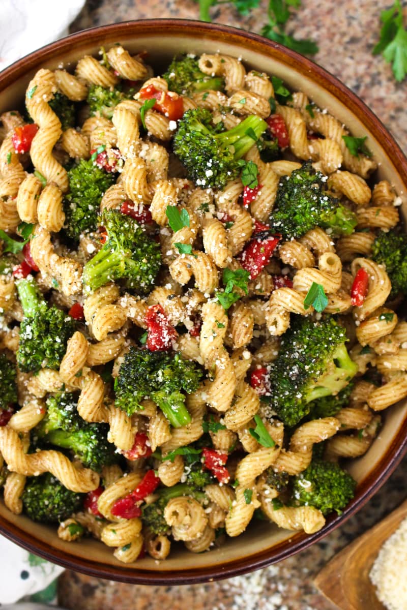 This Broccoli Pasta Salad is the perfect summer side dish for broccoli lovers! Tender-crisp pan-seared broccoli florets are tossed with cavatelli pasta, roasted red peppers, parmesan cheese, and zippy balsamic vinegar in this unforgettable, party-perfect salad. #broccoli #sidedish #pastasalad 