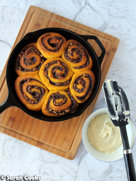 Pumpkin and pecan cinnamon rolls with cream cheese icing