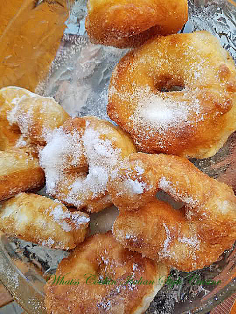 Delicious regular friedpizza dough, fried and dipped in sugar