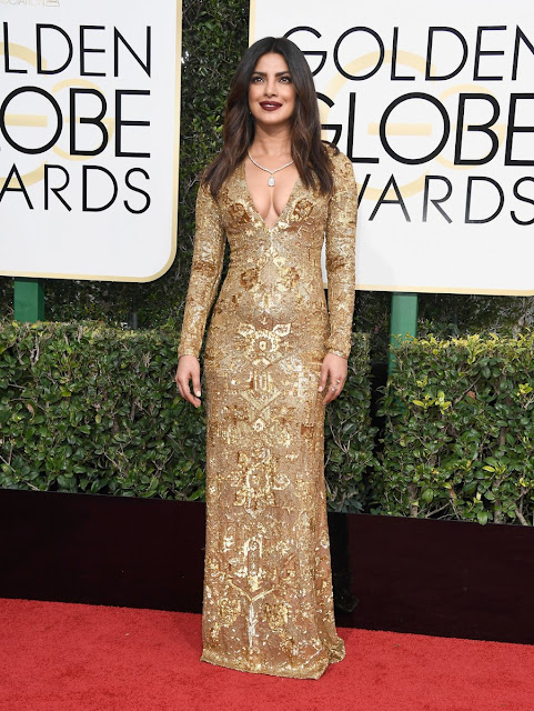 Priyanka looked ethereal in Ralph Lauren Golden Gown as she got ready to be presenter