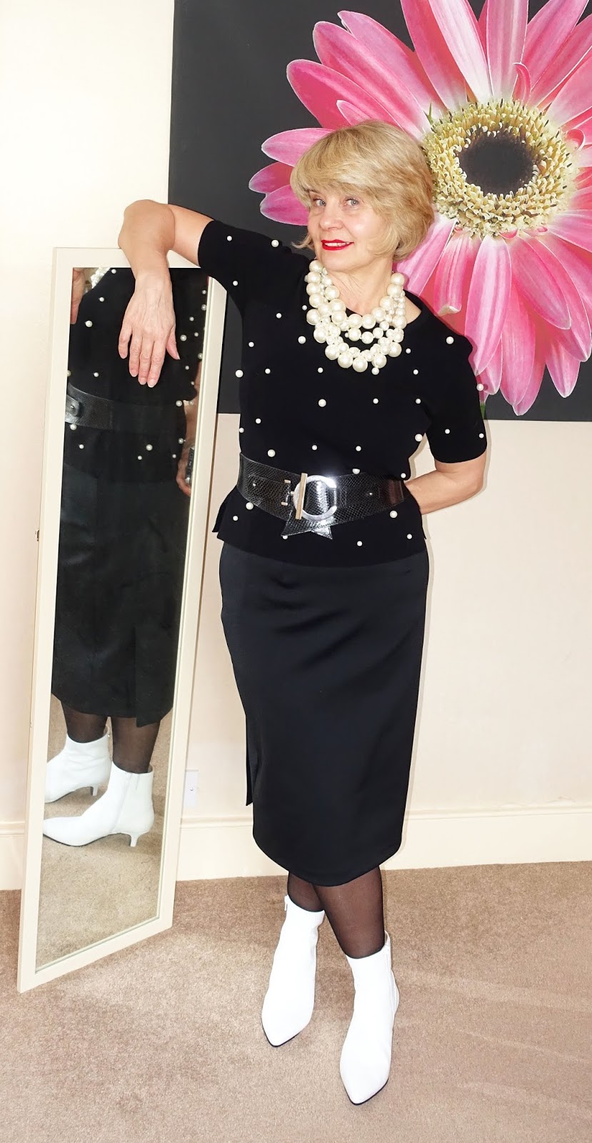 A black skirt and top with white ankle boots, layered pearl necklaces and 20 denier black shaping tights by FiOre, worn by over 45 blogger Gail Hanlon from Is This Mutton dot com