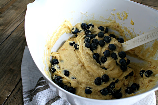 A bowl of dessert on a plate, with Blueberry