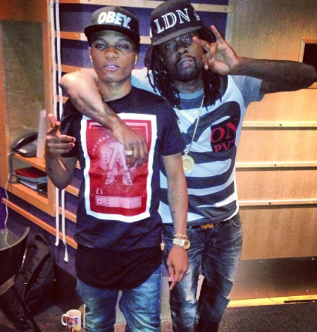 wizkid throws his drink at a man london