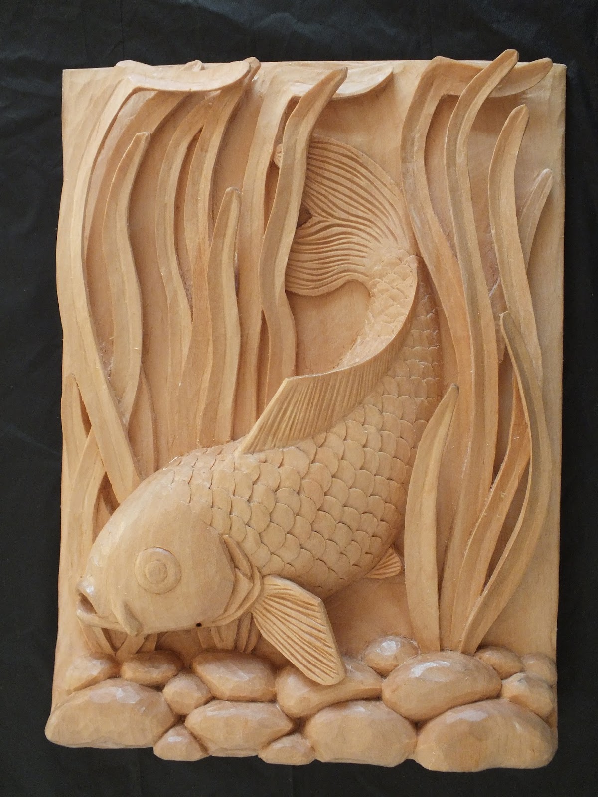 Duanes Carvings: Carp swimming through the reeds