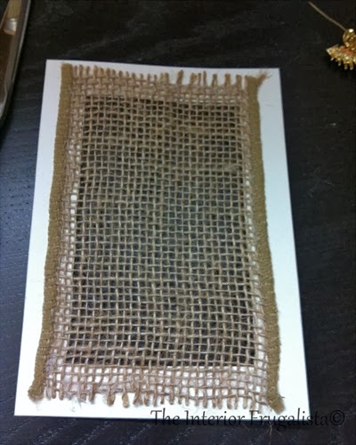 Glue burlap ribbon to the back of a picture frame mat
