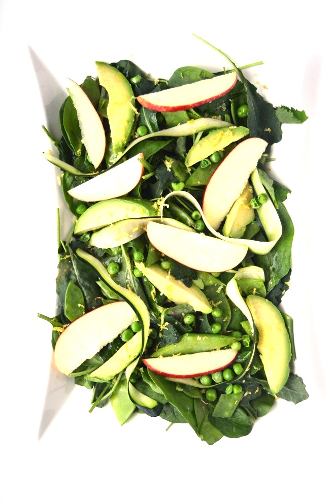 This Green Spring Salad is light and fresh for spring with a tangy lemon vinaigrette, avocado, apples, pea pods and zucchini. www.nutritionistreviews.com