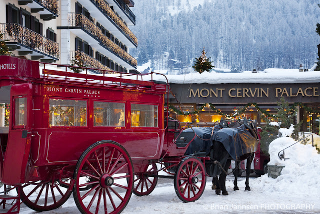 Mont Cervin Palace in Zermatt greets its guests at the nearby train station with its renowned red horse-drawn carriage.