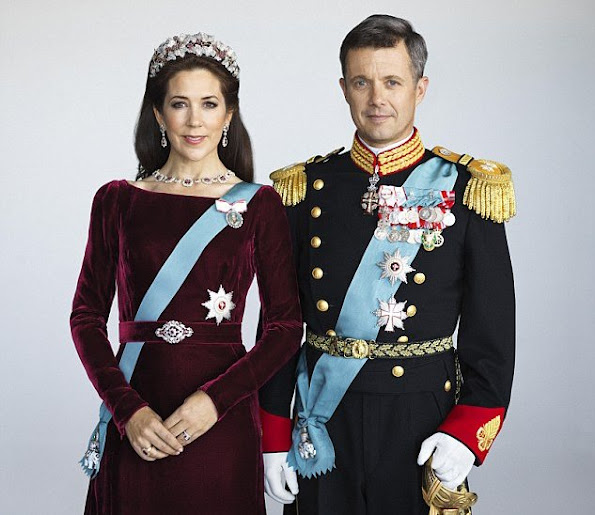 Re-styled glamour: To refresh her look, Mary (with Prince Frederik) accessorised the dress with different earrings and a necklace and wore the Order of the Elephant on a blue sash across her body