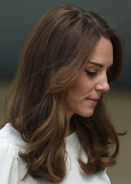 Kate Middleton, Prince William, and Prince Harry attend the official launch of Heads Together. Duchess Catherine wears Banana Republic Geo Jacquard Skirt