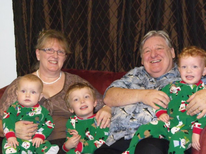 BRIAN AND GILLY WITH THREE OF THEIR THIRTEEN GRANDCHILDREN