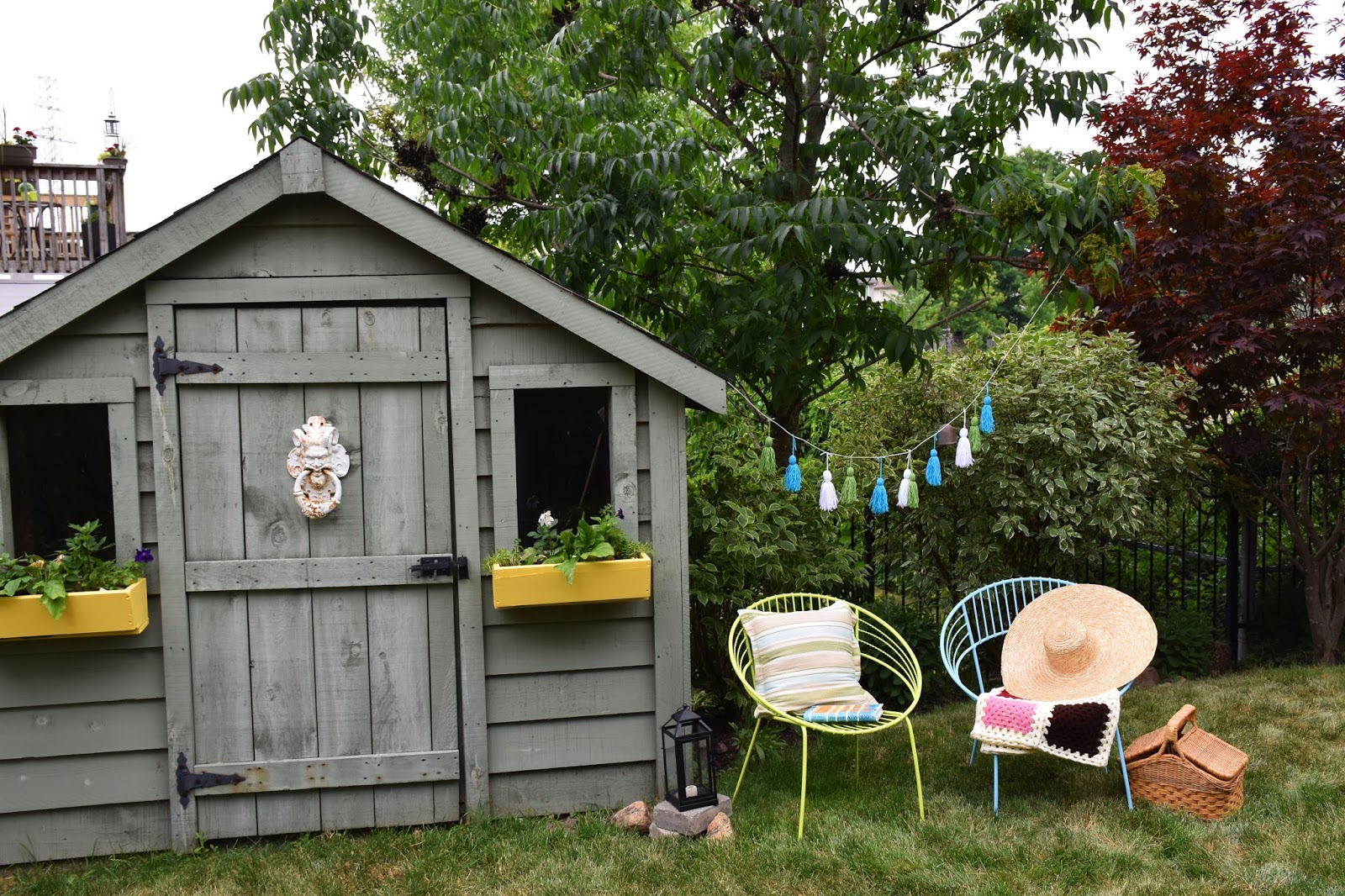 Woman in Real Life Sunny Yellow Window Boxes, A Tassel Garland & A Lotta Spray Paint (Summer