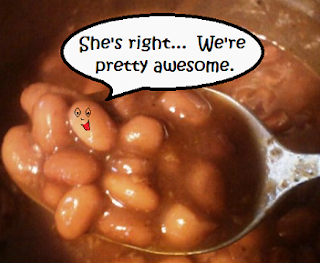 Baked beans on a spoon - one is saying, "She's right... We're pretty awesome."
