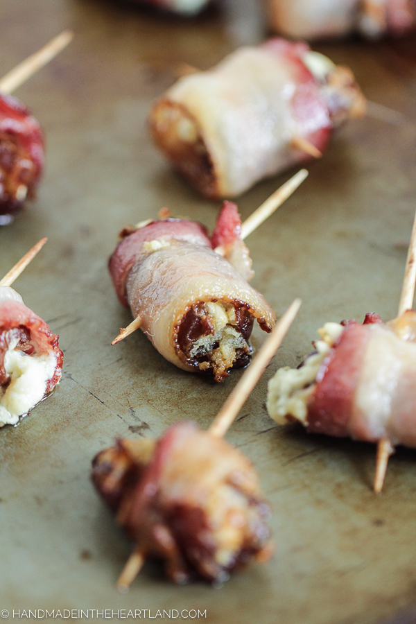 A perfect party appetizer to impress your friends, these bacon wrapped stuffed dates are delicious!