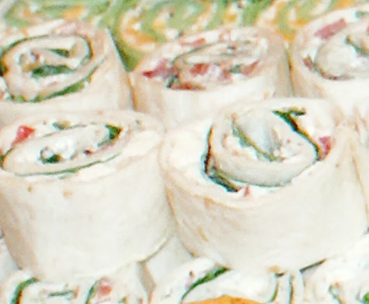 Greek Pinwheels are super easy to make and filled with classic greek flavors.  They are perfect for a party!