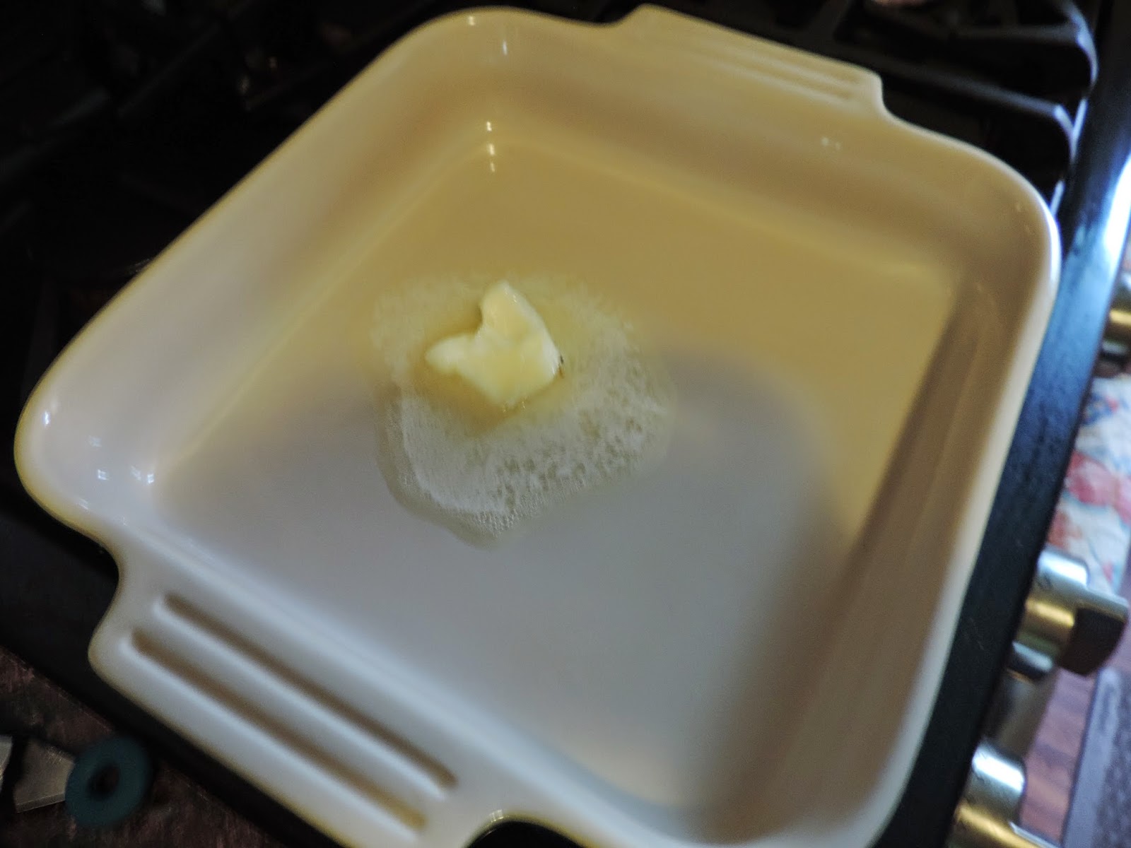 Butter melting in the baking dish.