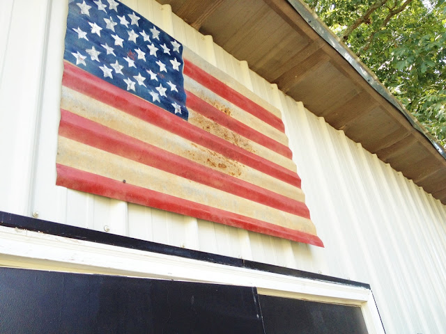 old metal roofing painted as American flag