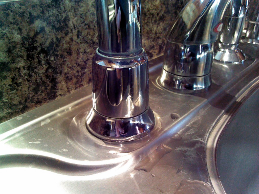 moen kitchen sink faucet leaking at base