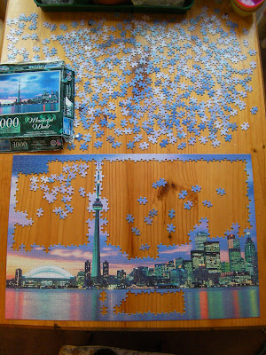 partially completed difficult jigsaw in progress 