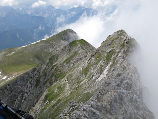 Die ersten Wolken wallen an Kirchlspitze und Brunnensteinspitze