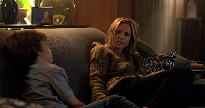 Maria Bello and Gabriel Bateman star in the horror film Lights Out