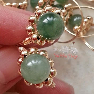 Close up of Wire Wrapped Sparkly Rings with jade and 14k gold filled wire and 3mm gold filledbeads