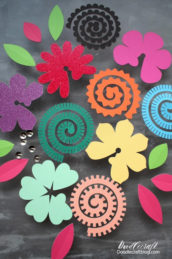 Colored paper cut outs to form into 3D flowers