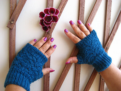 http://buttonsandbeeswax.com/patterns/mitts-and-gloves/nordic-lace-mittens-knitting-pattern/
