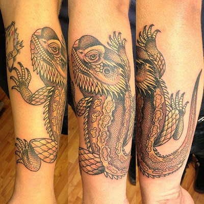 Tatuaje de iguana en el antebrazo
