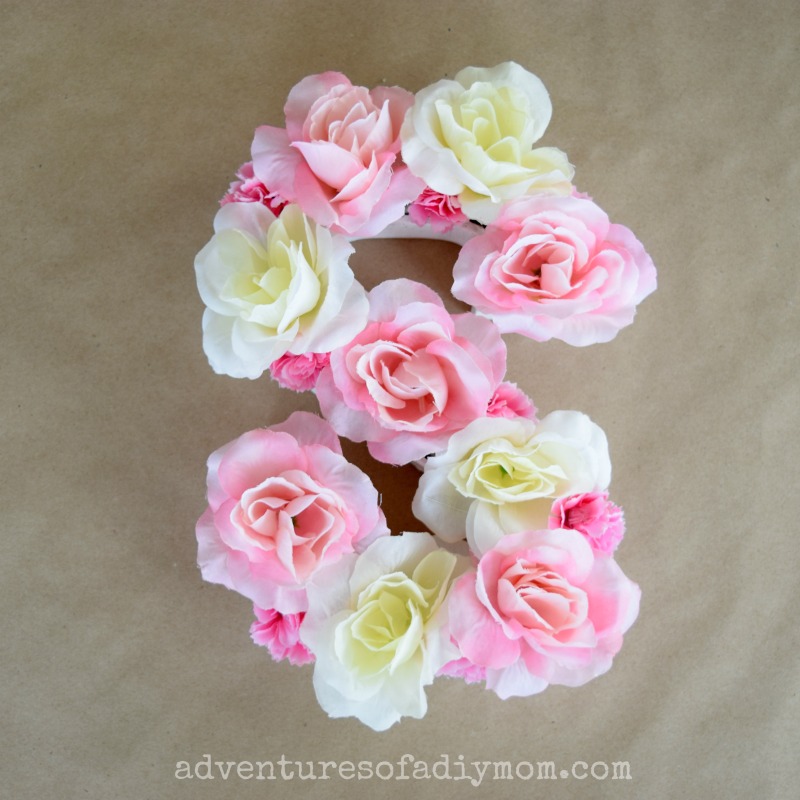 Use a paper mache letter, floral foam, and fake flowers to make a personal  floral initial to brighten up any room. Simp…