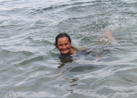 A old woman enjoying a swim. A old woman enjoying a swim.