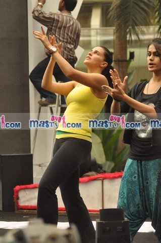 Neha Dhupia in Black tights and yellow top1 - Neha Dhupia Practice for Sahara Star Seduction