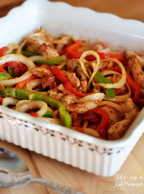 Oven Baked Chicken Fajitas are filled with flavorful chicken, onion, tomatoes and red and green bell peppers. Life-in-the-Lofthouse.com