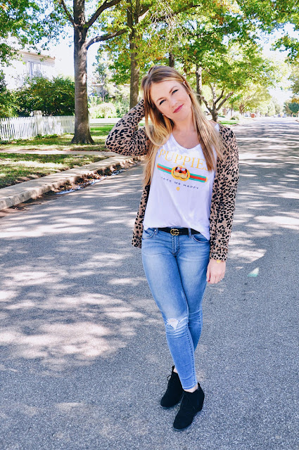Girl wearing Leopard Cardigan and Puppy Tee on a tree lined street