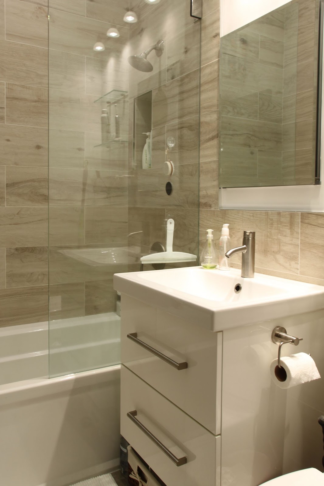 built in recessed storage in the shower european style glass panel instead of a shower curtain super easy to clean