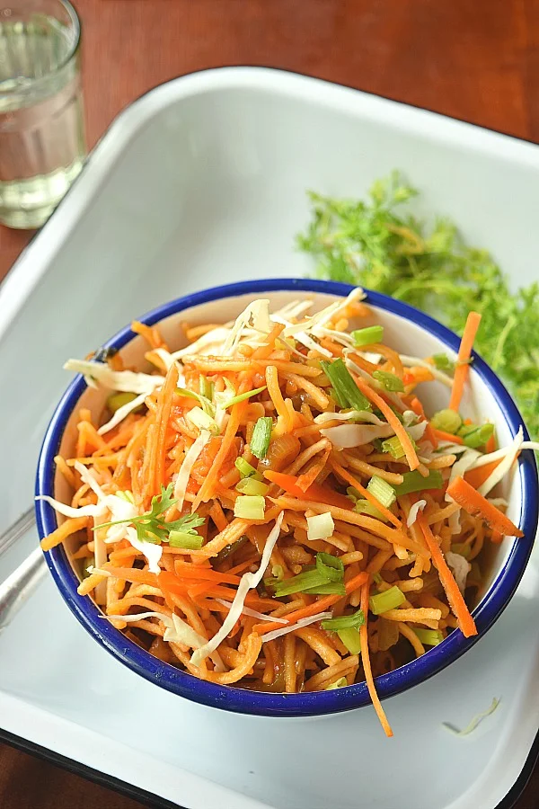 Top look of a bowl of Chinese Bhel noodle salad with carrots,capsicum,cabbage