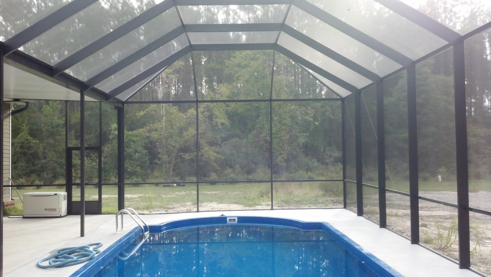 Screen Rooms Tallahassee Pool Enclosure with solid roof area in