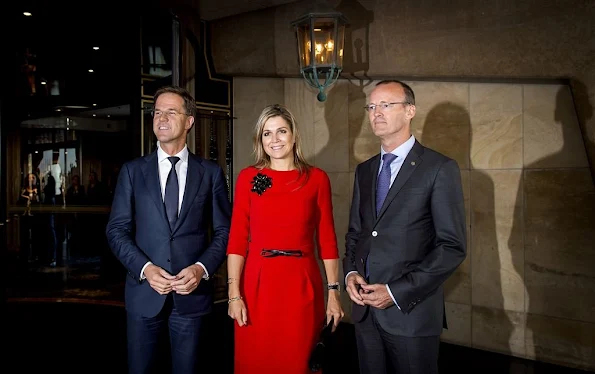 Queen Maxima of The Netherlands with prime minister Mark Rutte and Dutch Bank director Klaas Knot