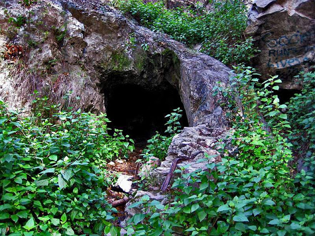 This is Tunnel Number 4 in Las Flores Canyon. Ore cart rail protrude from the portal.