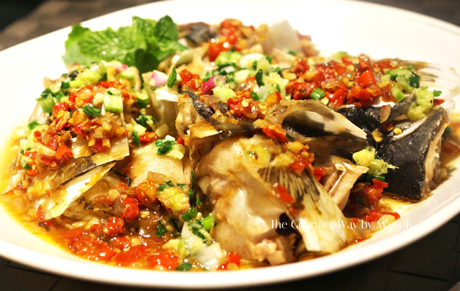 Steamed Fish Head with Homemade Chopped Chili Pepper Sauce . 自家剁椒蒸魚頭