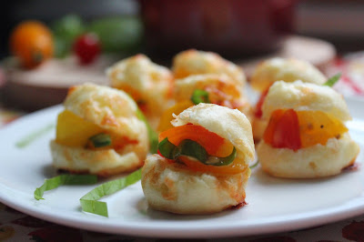 Mini profiteroles with tomatoes and basil