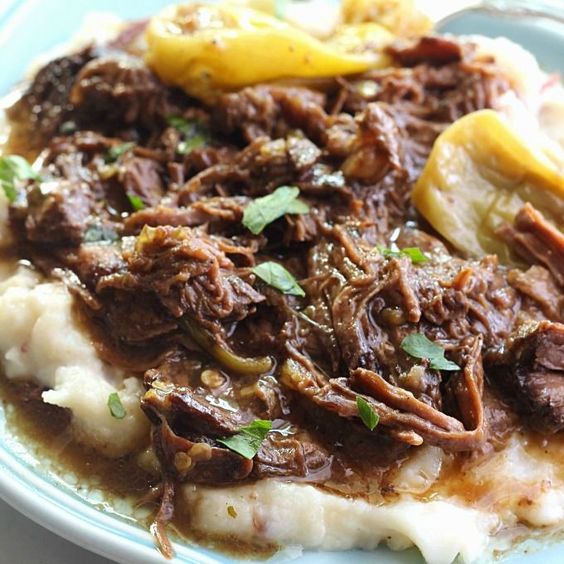 Slow Cooker "Melt in Your Mouth" Pot Roast ~ The meat is juicy and fall-apart tender. The vegetables are cooked just right and are full of flavor. The seasonings are simply spot on and the broth yields a fabulous gravy-like sauce that is divine when poured over everything prior to serving.