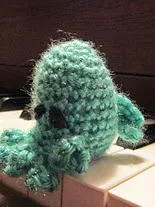 http://www.ravelry.com/patterns/library/chthulu-finger-puppet